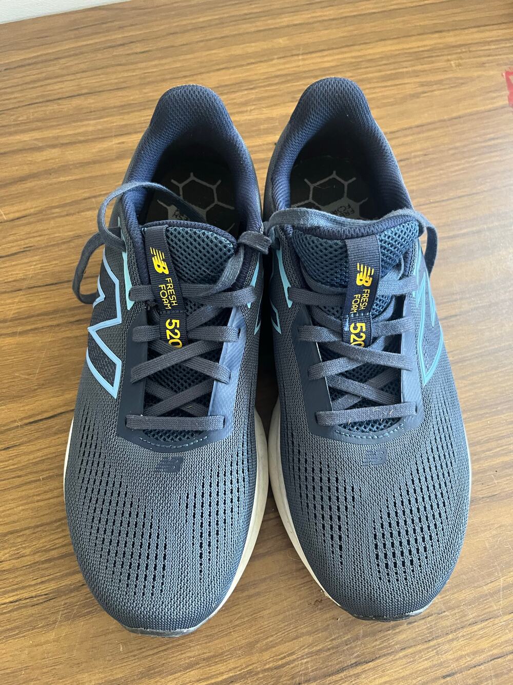New Balance 520 navy mesh running sneakers with light blue logo and cushioned so